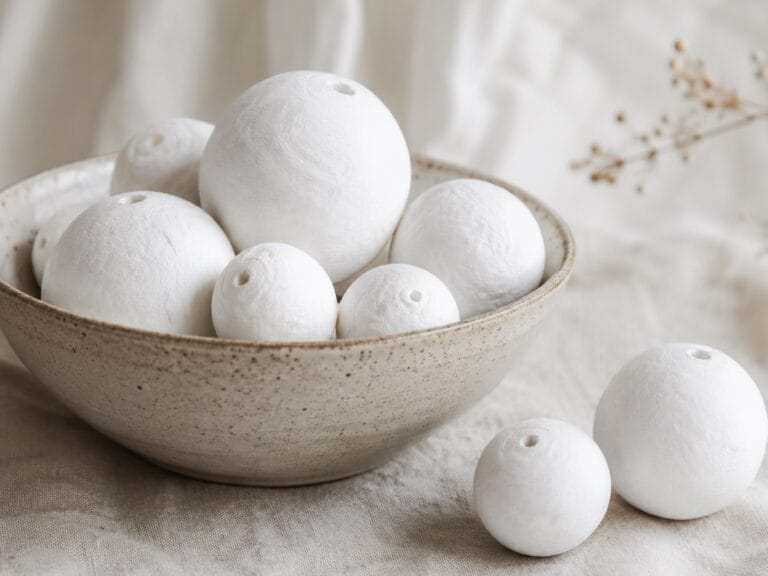 paper balls in cream bowl